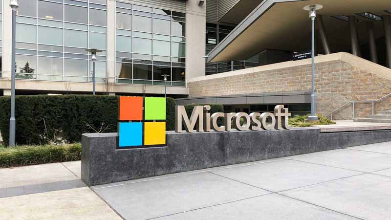 Microsoft sign at entrance of building.