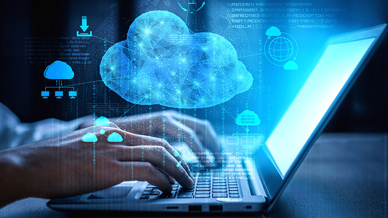 Person using cloud technology on their laptop.